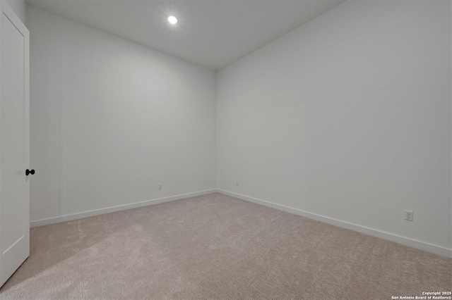 209 Teakmill Trl, San Marcos, TX 78666 - spare room with light colored carpet, baseboards, and recessed lighting