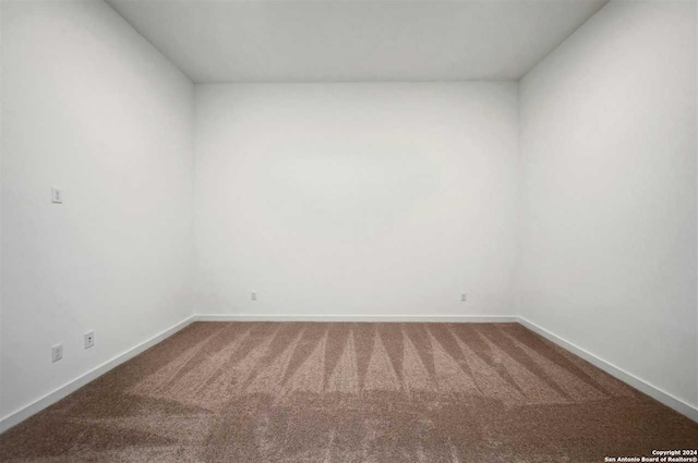 empty room with carpet flooring