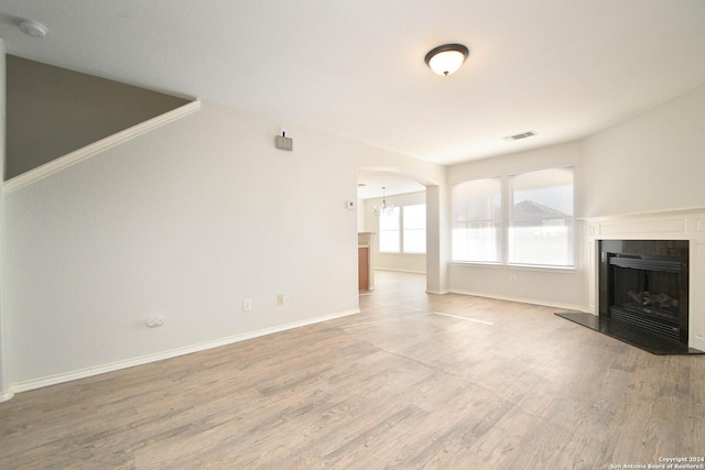 unfurnished living room with hardwood / wood-style flooring