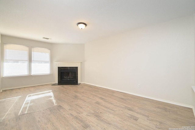 unfurnished living room featuring light wood-type flooring