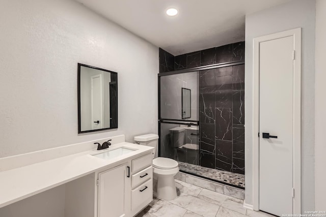 bathroom featuring walk in shower, vanity, and toilet