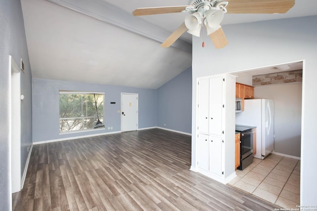 kitchen featuring black range with electric stovetop, ceiling fan, vaulted ceiling with beams, light hardwood / wood-style flooring, and white refrigerator with ice dispenser