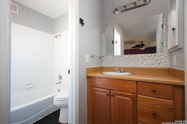 full bathroom with vanity, toilet, ceiling fan, and tub / shower combination