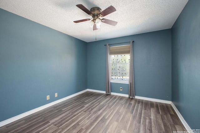 unfurnished room featuring hardwood / wood-style flooring, ceiling fan, and a textured ceiling