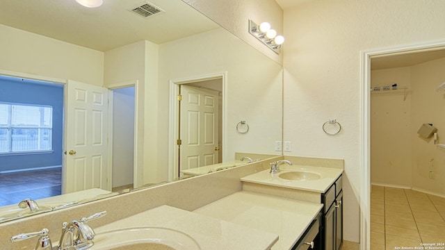 bathroom featuring tile patterned floors and vanity