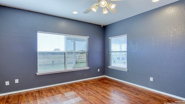 unfurnished room featuring ceiling fan and hardwood / wood-style flooring