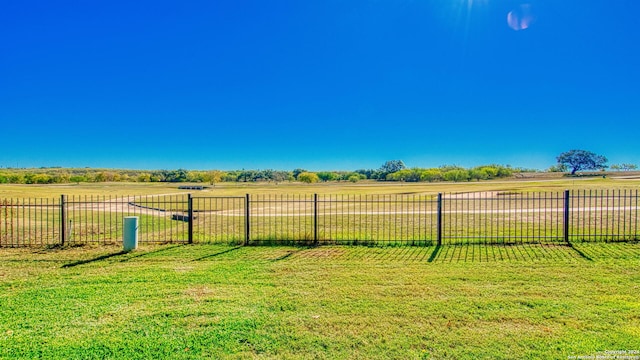 view of yard with a rural view