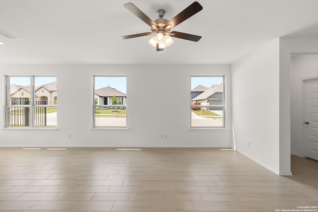 unfurnished room with ceiling fan