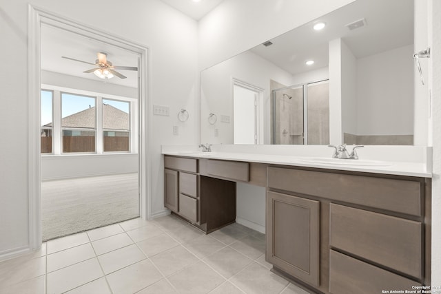 bathroom with vanity, tile patterned floors, ceiling fan, and walk in shower