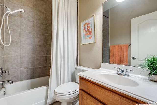 full bathroom featuring vanity, shower / bath combination with curtain, and toilet