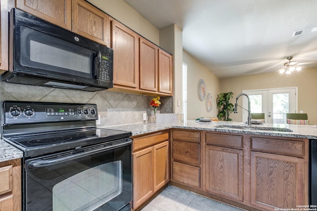 kitchen featuring french doors, black appliances, sink, tasteful backsplash, and kitchen peninsula