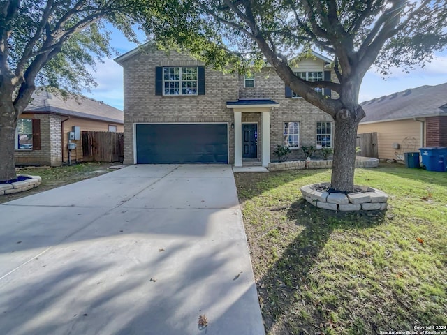 view of front facade featuring a garage and a front lawn