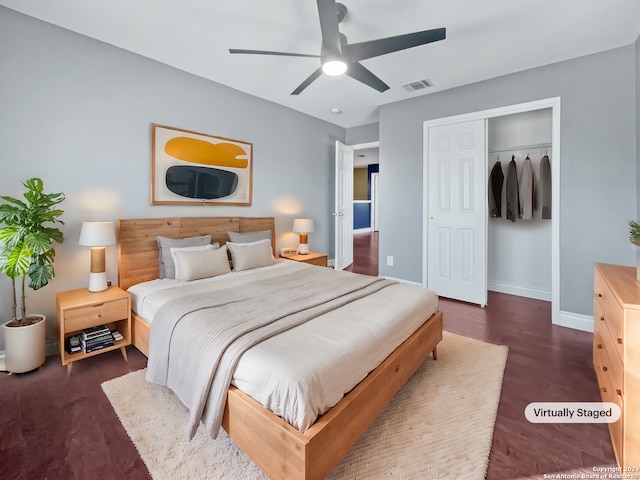 bedroom featuring a closet, ceiling fan, and dark hardwood / wood-style floors