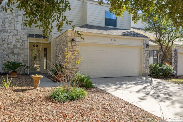 front facade with a garage