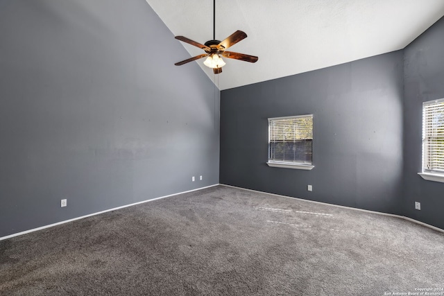 spare room featuring carpet, ceiling fan, and high vaulted ceiling