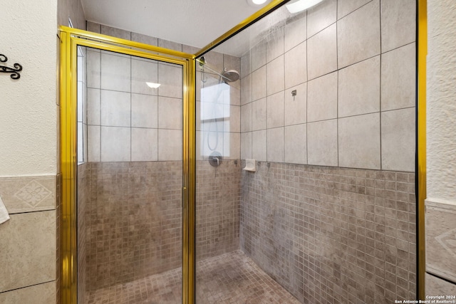 bathroom featuring an enclosed shower