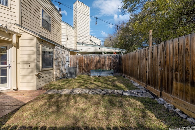 view of yard with central AC unit