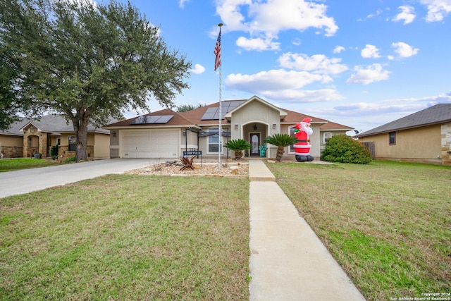 single story home with solar panels, a garage, and a front lawn