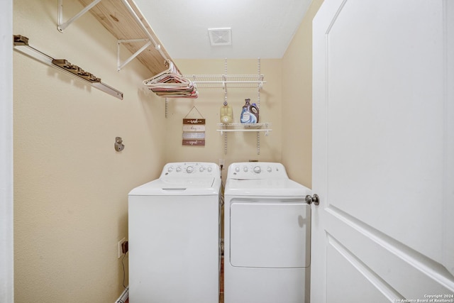 clothes washing area with independent washer and dryer