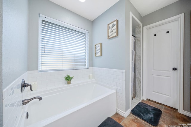 bathroom featuring plus walk in shower