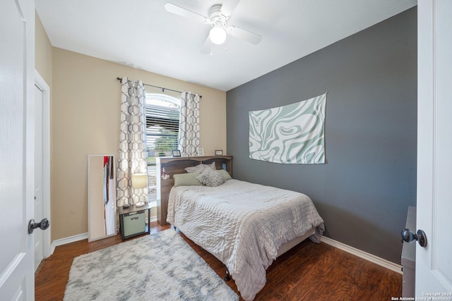 bedroom with ceiling fan and dark wood-type flooring