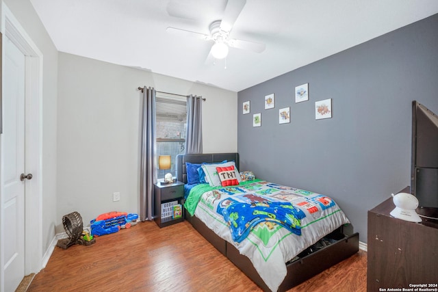 bedroom featuring ceiling fan and wood-type flooring