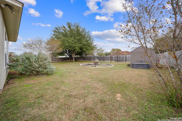 view of yard featuring a fire pit