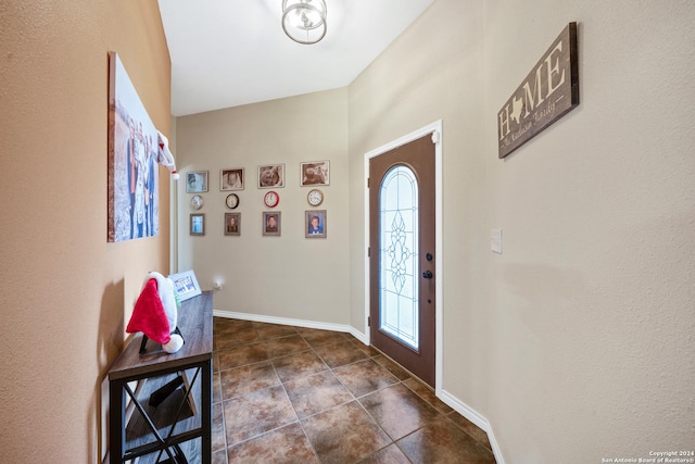 tiled foyer featuring plenty of natural light