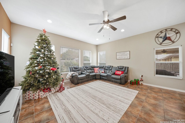 tiled living room with ceiling fan and plenty of natural light