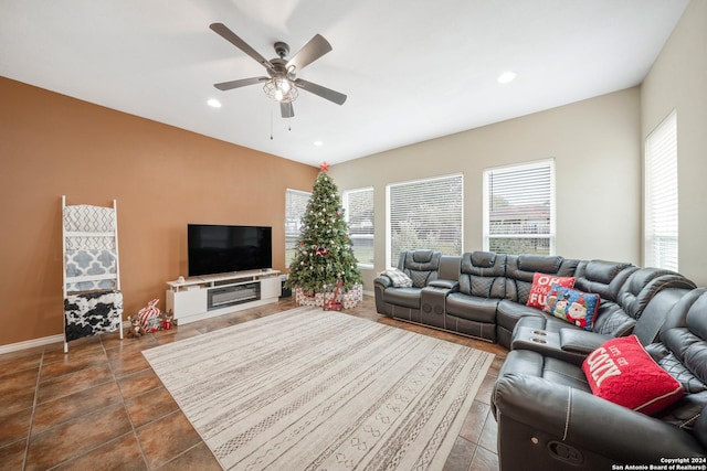 tiled living room featuring ceiling fan