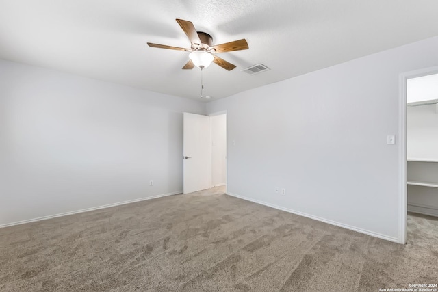 unfurnished room featuring carpet flooring and ceiling fan