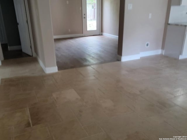 spare room with wood-type flooring