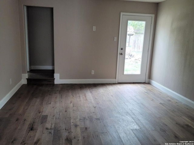 spare room featuring hardwood / wood-style floors