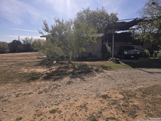 view of yard with a carport