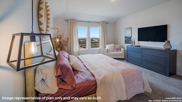 carpeted bedroom featuring lofted ceiling