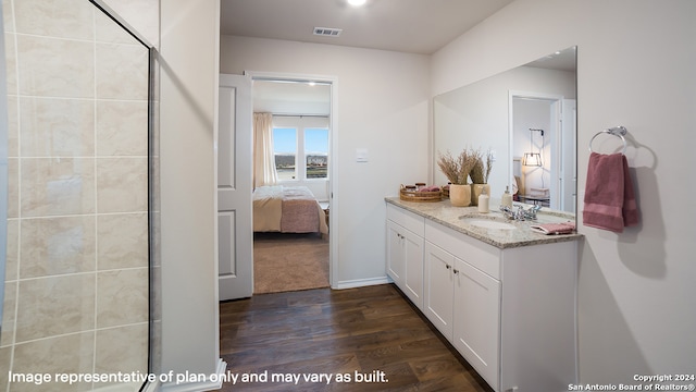 bathroom with vanity and hardwood / wood-style flooring