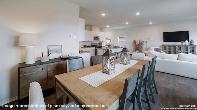 dining area with dark hardwood / wood-style flooring