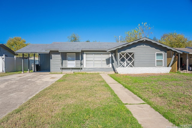 single story home with a front lawn and a carport