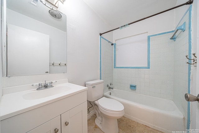 full bathroom featuring tile patterned flooring, vanity, toilet, and tiled shower / bath combo