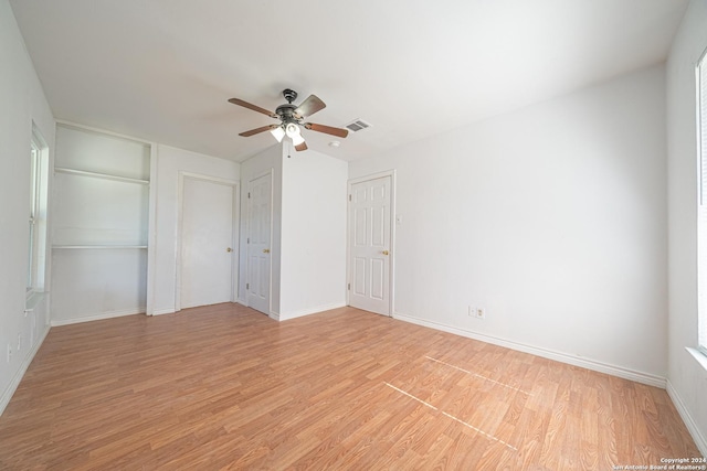 unfurnished bedroom with ceiling fan and light hardwood / wood-style flooring