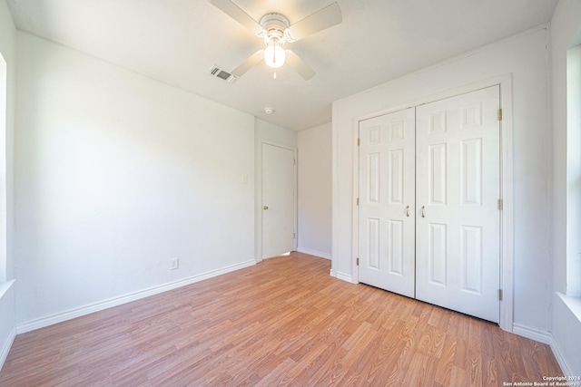 unfurnished bedroom with a closet, ceiling fan, and light hardwood / wood-style flooring