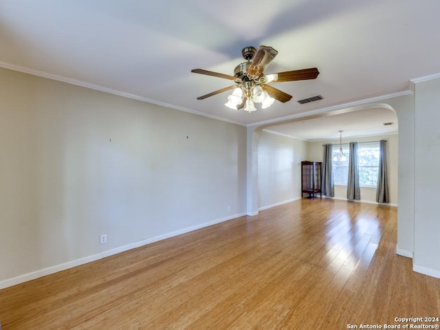 spare room with ceiling fan, light hardwood / wood-style flooring, and ornamental molding