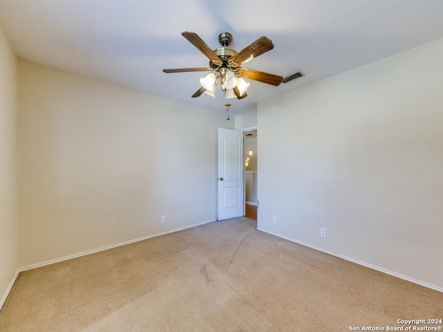 carpeted empty room with ceiling fan