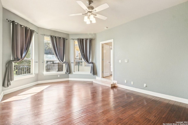 unfurnished room with light wood-type flooring and ceiling fan