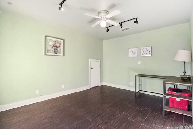 interior space with ceiling fan, dark hardwood / wood-style flooring, and track lighting