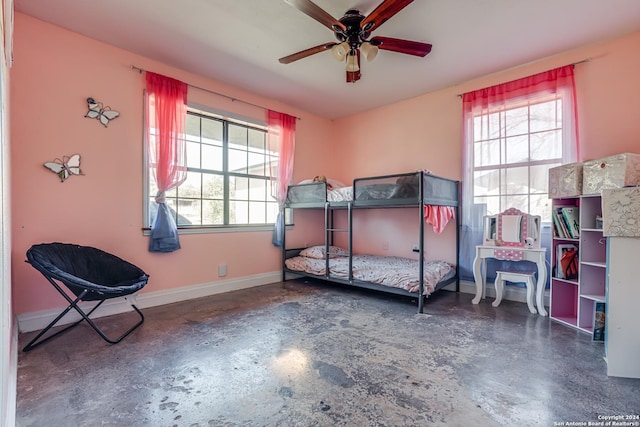 bedroom featuring multiple windows and ceiling fan