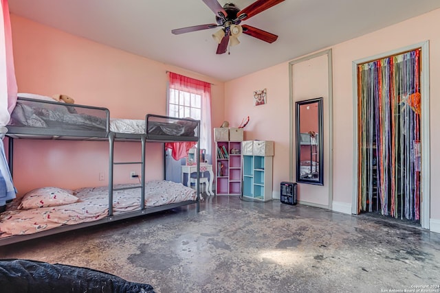 bedroom with concrete floors and ceiling fan