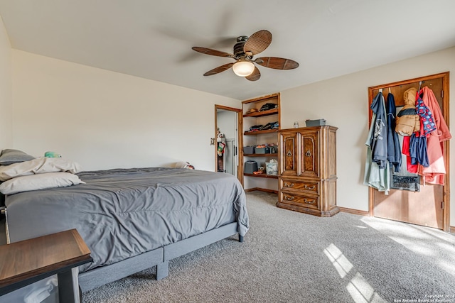 carpeted bedroom with ceiling fan and a closet