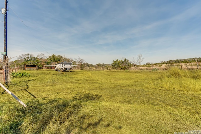 view of yard with a rural view