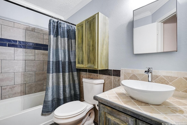 full bathroom featuring shower / tub combo, a textured ceiling, sink, tile walls, and toilet